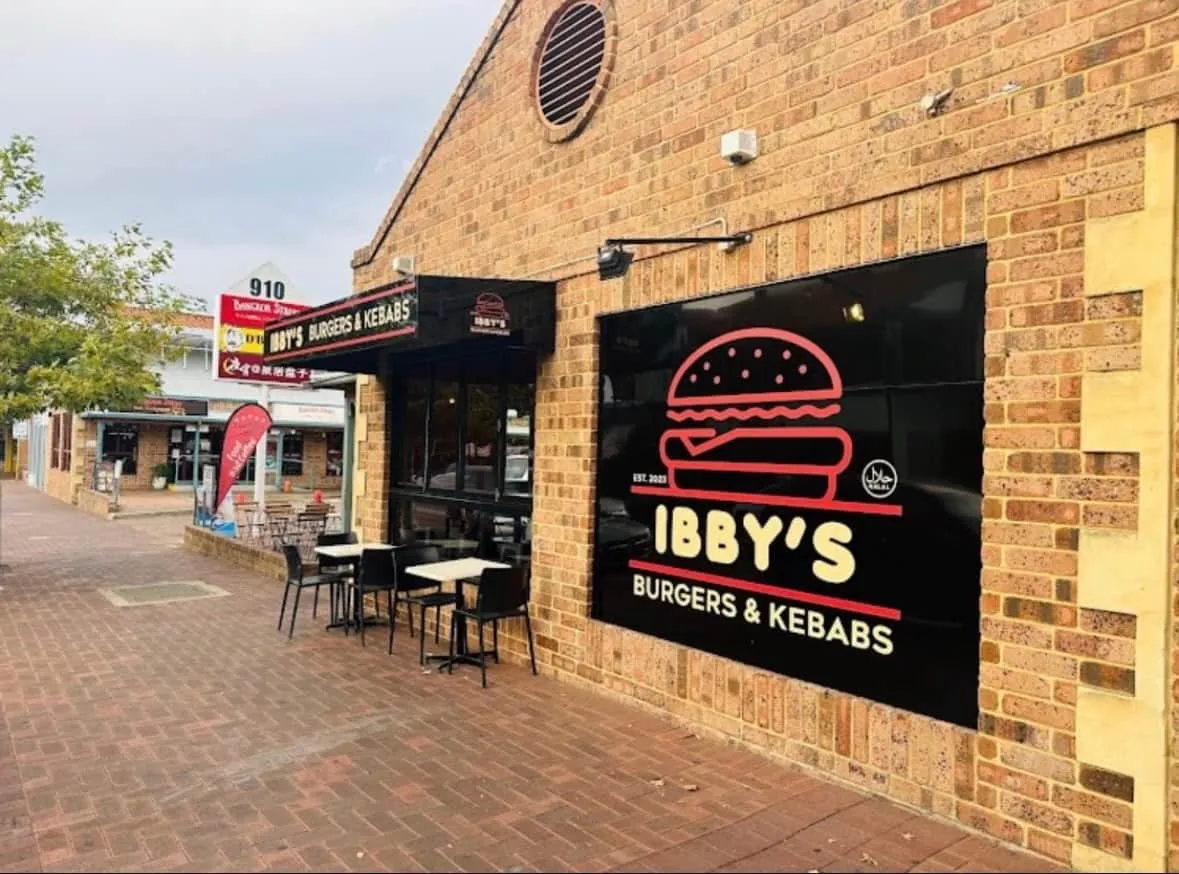 The Ibby’s shopfront on Albany Highway with outdoor tables and red chairs